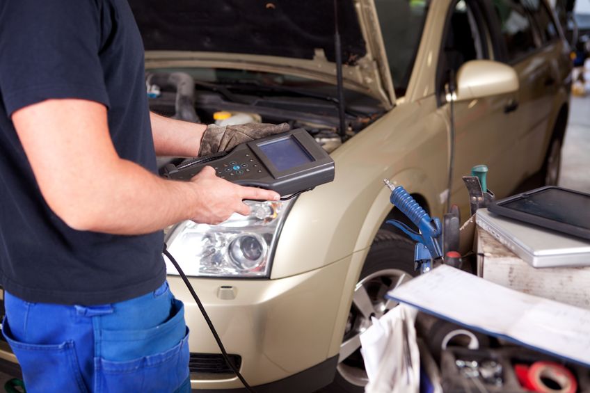 Mechanic with Electric Diagnostic Computer